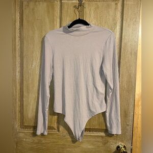 Long Sleeve Mock Nexk Ribbed Bodysuit in tan. AEO. XL